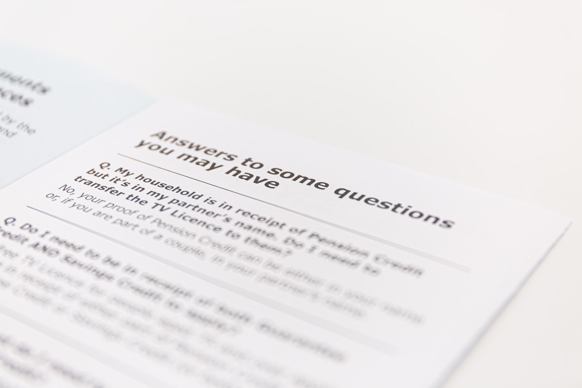 Notebook and pen on a desk representing frequently asked questions about headline capitalization